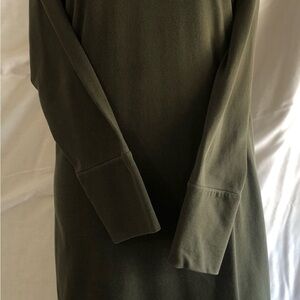 Long sleeve dark green dress.